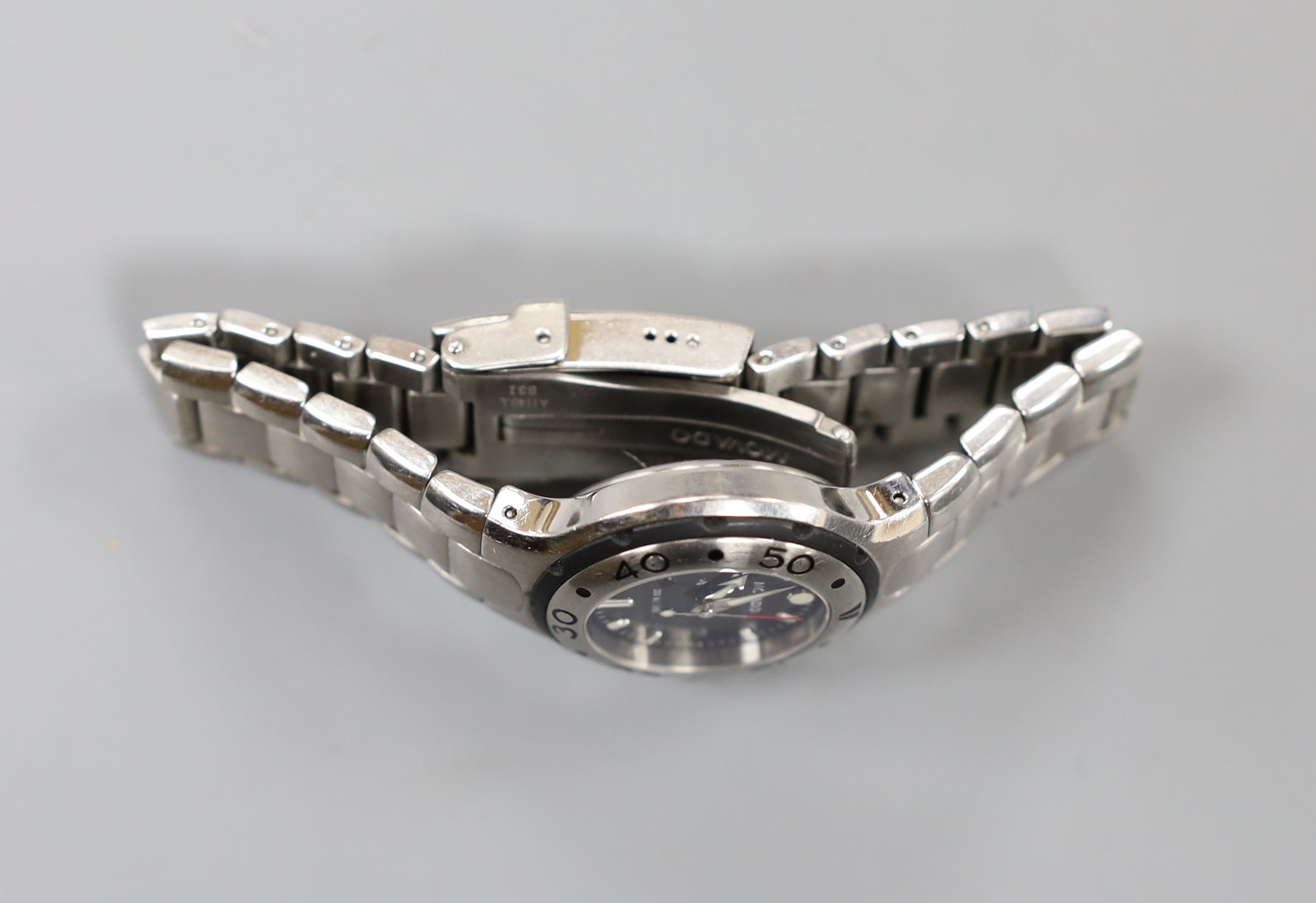 A lady's modern stainless steel Movado quartz wrist watch, on a stainless steel Movado bracelet, with box.